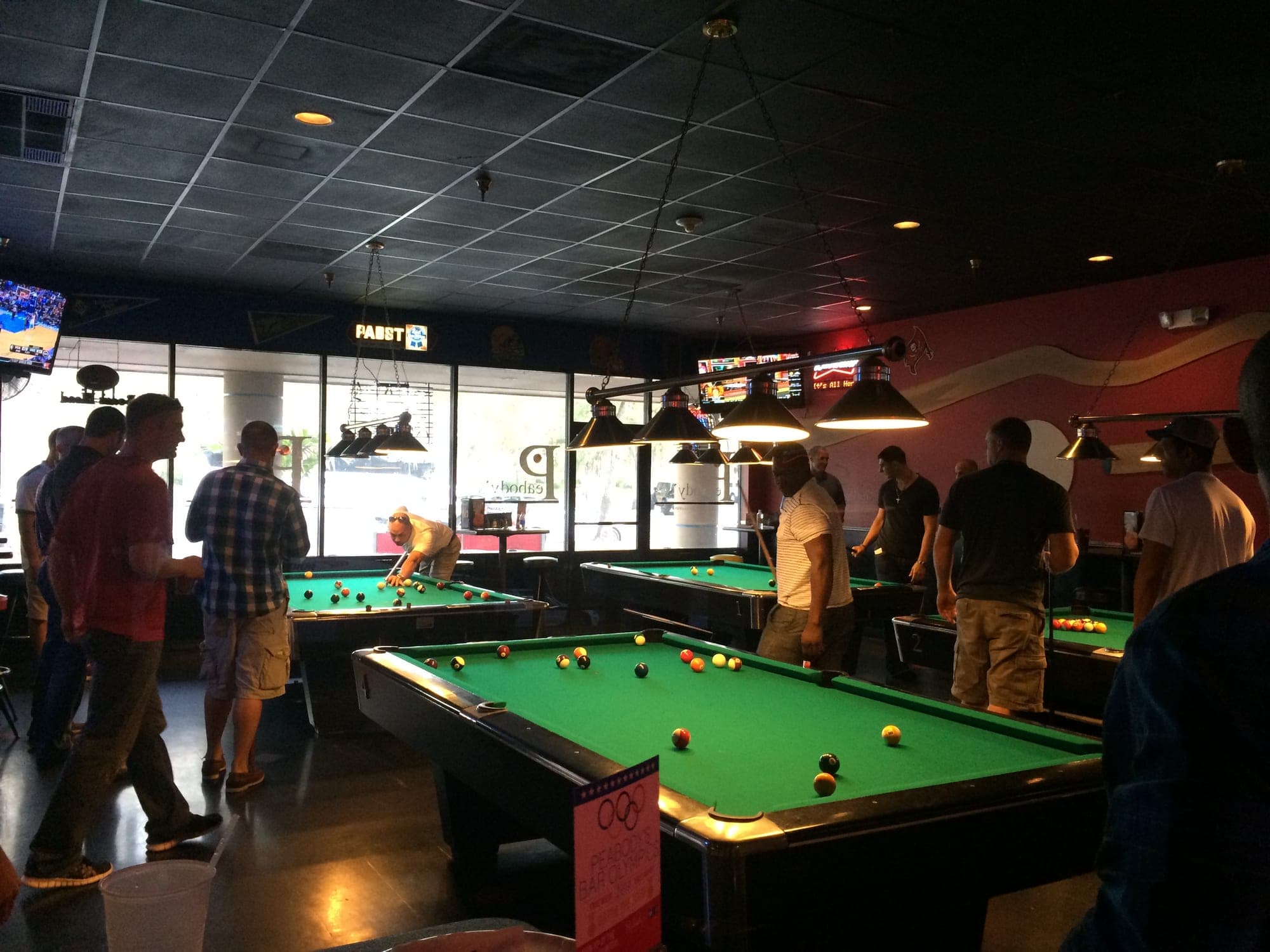 Yankees players and staff hitting the tables during their Spring Training billiards tournament.